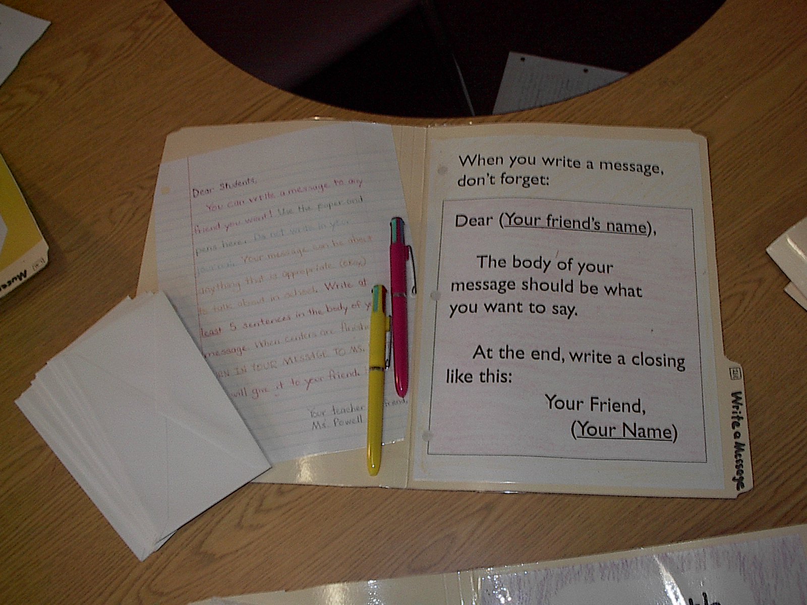 Write a Message: The focus here is writing for a meaningful purpose. Many students only write in school, and because they have to–this is an opportunity to show them that writing can be fun and useful in their own lives,. They can write a letter to whoever they want, and after showing it in to me after center time, can give it to that person. Students use different colored ink pens, which makes it really fun! The left side of the folder demonstrates proper letter writing format, which I insist on towards the end of the year, although I allow casual notes in the beginning. You could also use this center for formal/business letter practice.